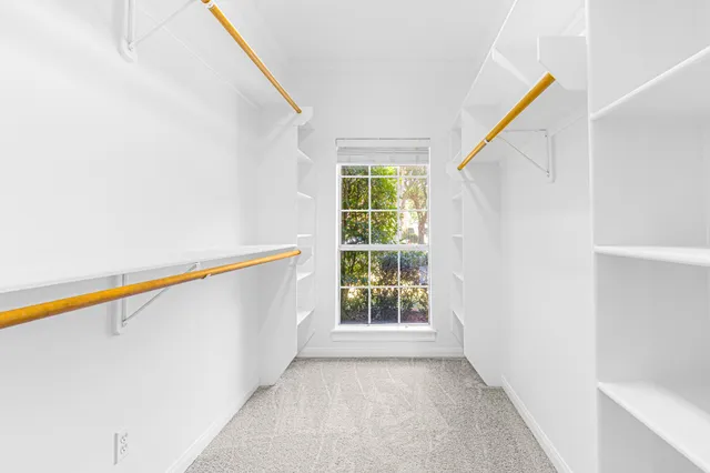 an aerial view of a house with a lake view