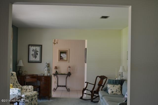 3943 Heath Road Jacksonville, FL 32277 - Photo 10 of 49 a workspace with furniture and a couch