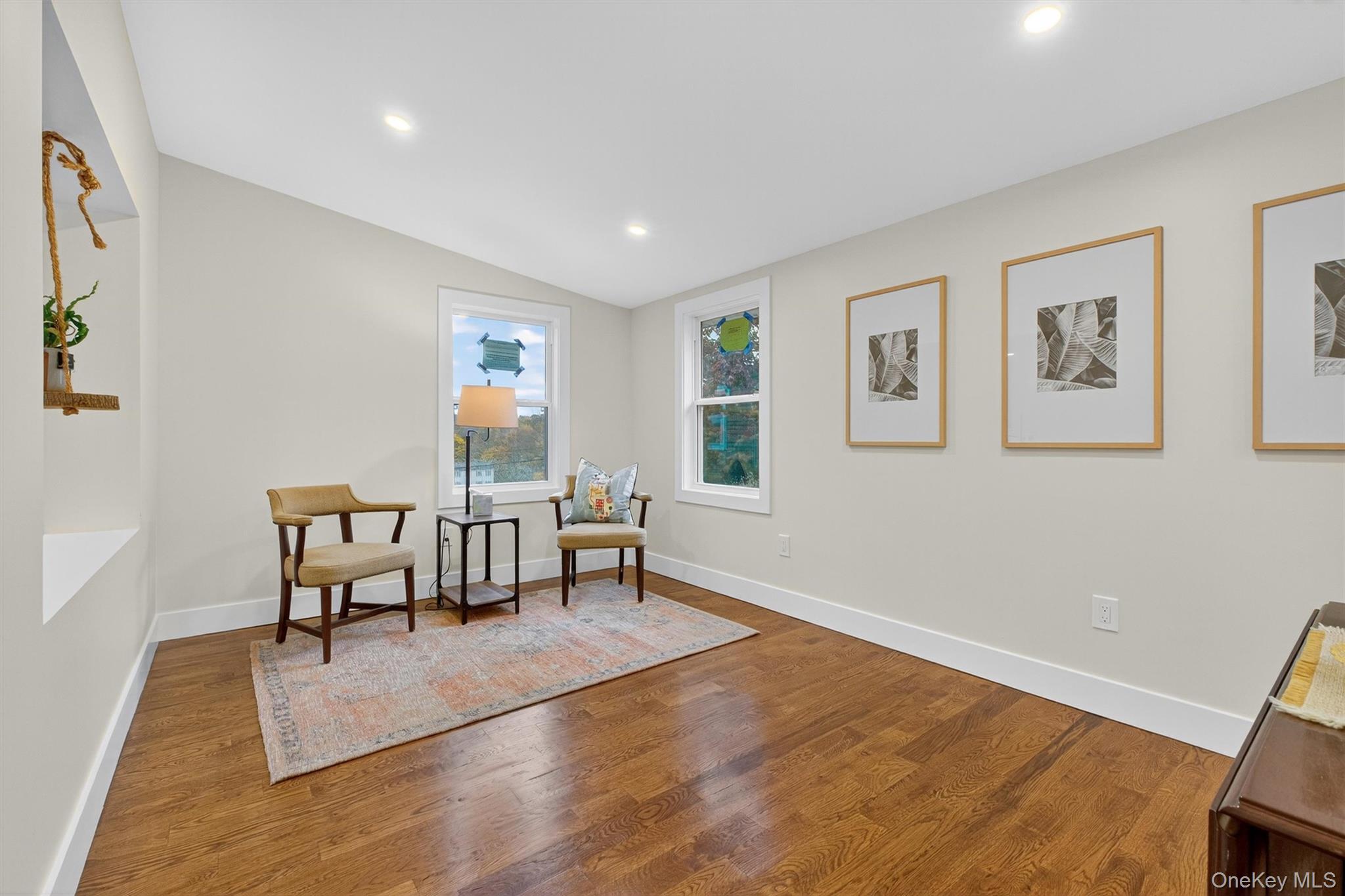 86 Vassar Road Poughkeepsie, NY 12603 - Photo 16 of 31 Living area with wood finished floors, recessed lighting, and vaulted ceiling
