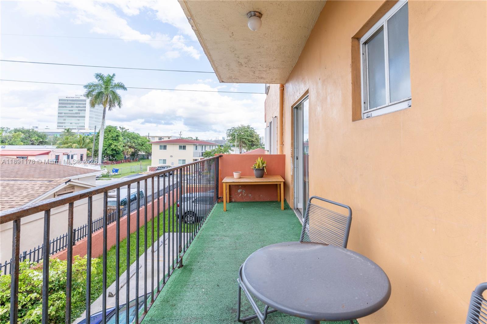 2921 Southwest 10th Street, Unit 26 Miami, FL 33135 - Photo 15 of 19 a view of a porch with furniture