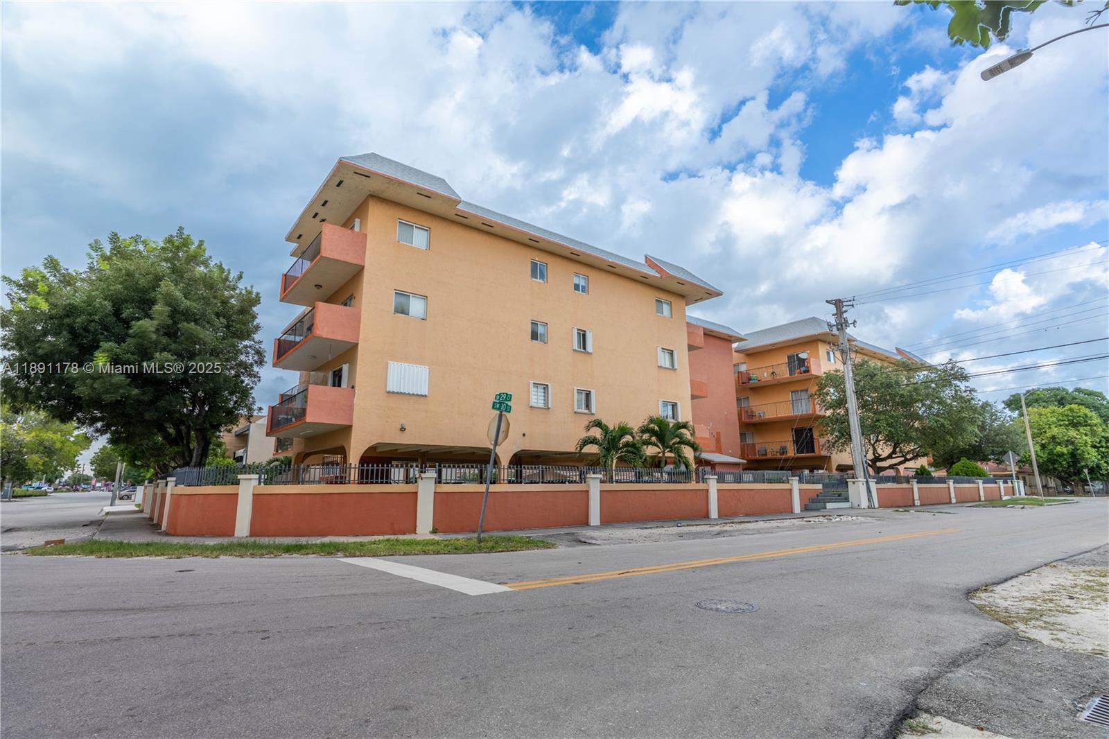 2921 Southwest 10th Street, Unit 26 Miami, FL 33135 - Photo 18 of 19 a city view with tall buildings and a cars parked in front of it