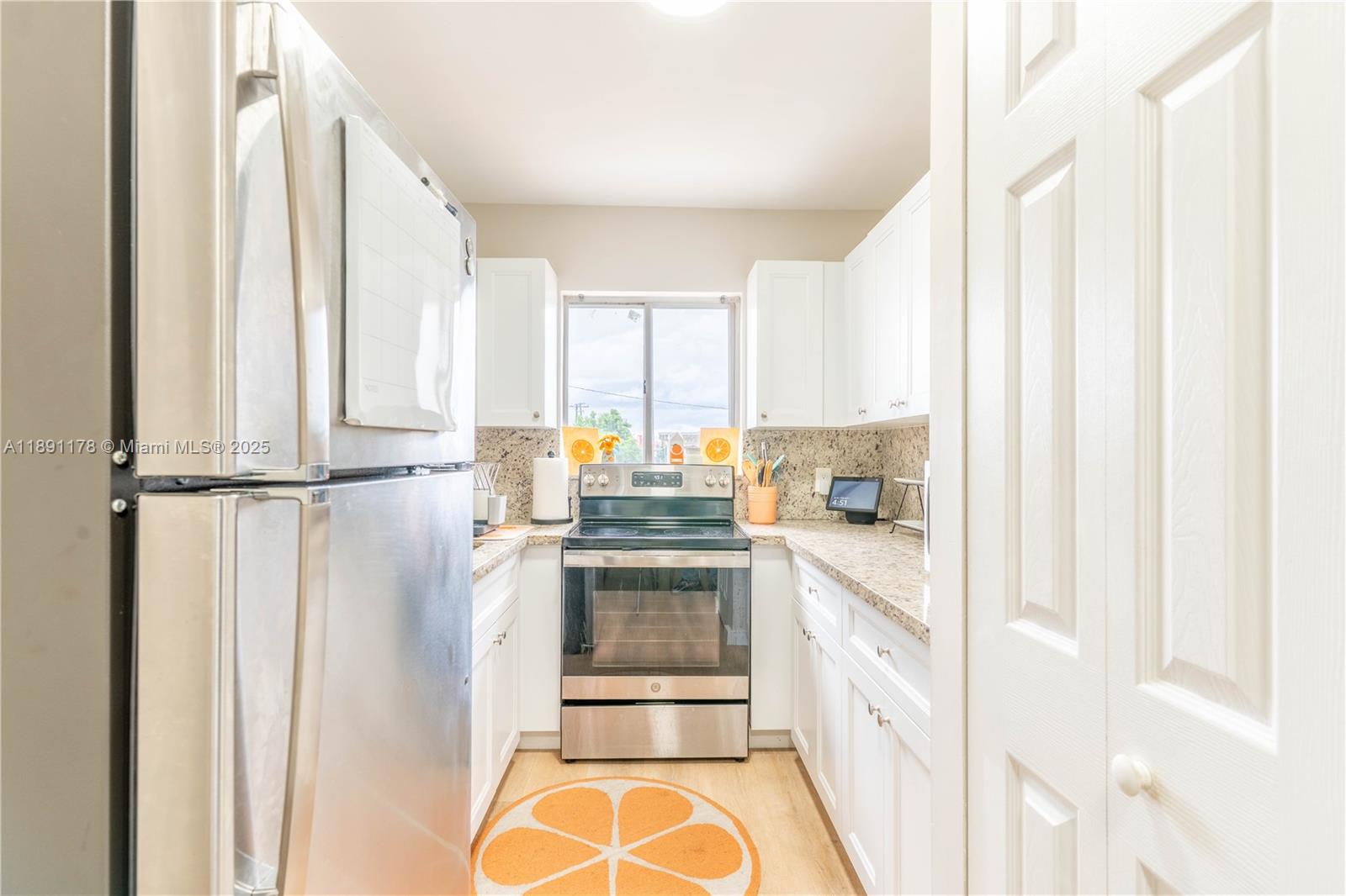 2921 Southwest 10th Street, Unit 26 Miami, FL 33135 - Photo 6 of 19 a kitchen with stainless steel appliances a stove and a refrigerator