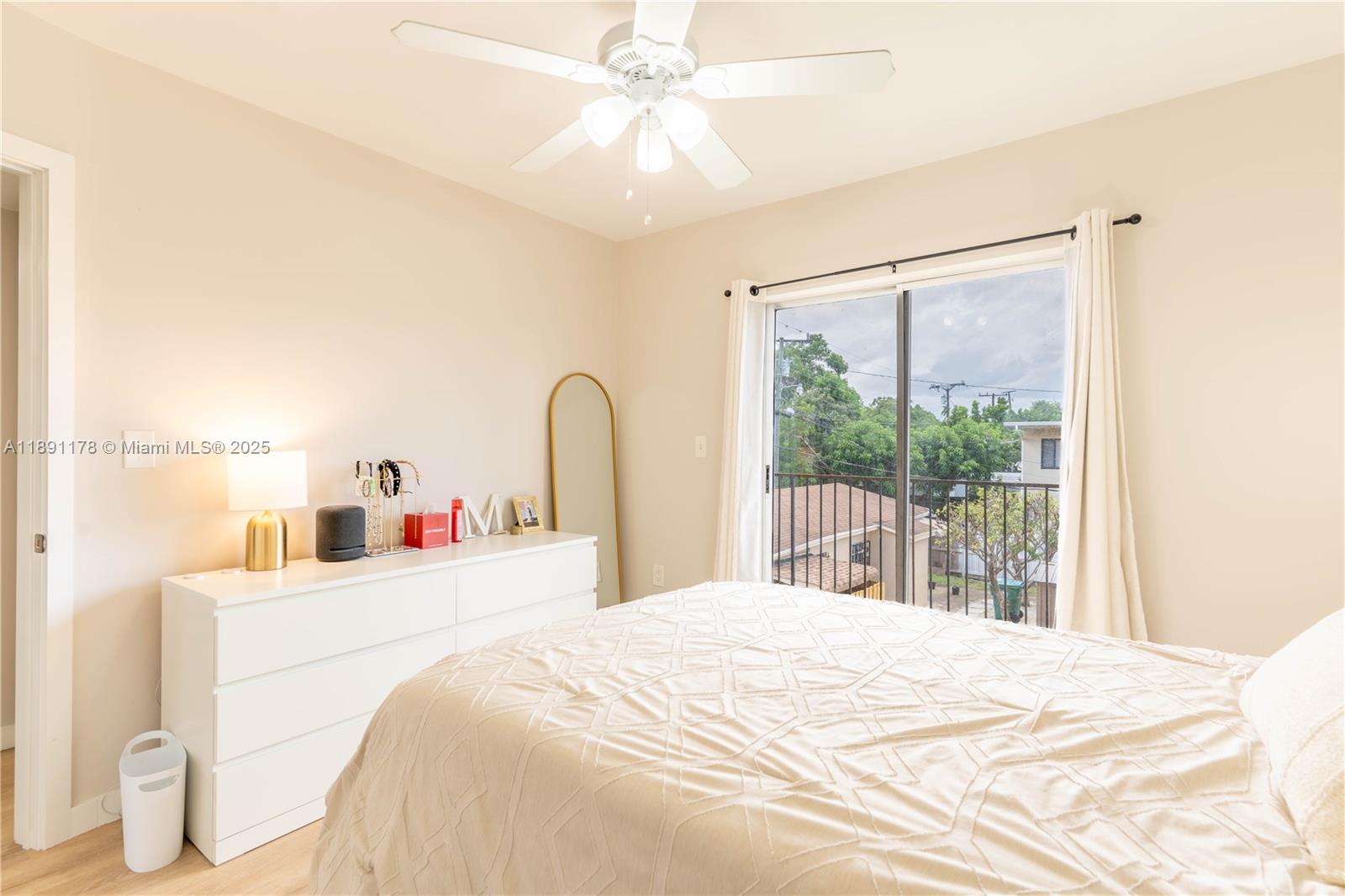 2921 Southwest 10th Street, Unit 26 Miami, FL 33135 - Photo 9 of 19 a bedroom with a bed and a large window