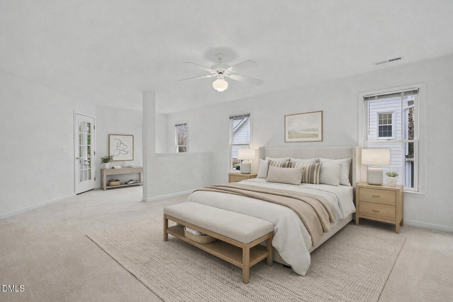 10415 Ashmead Lane Raleigh, NC 27614 - Photo 23 of 44 a spacious bedroom with a bed painting on wall and two windows