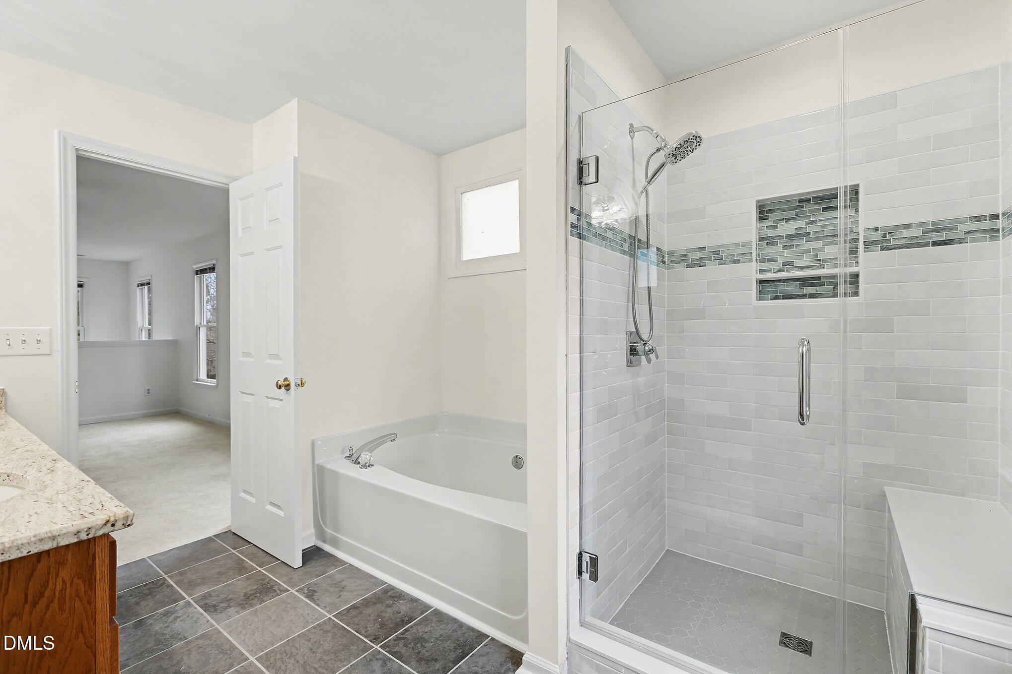10415 Ashmead Lane Raleigh, NC 27614 - Photo 28 of 44 a bathroom with a tub shower and sink