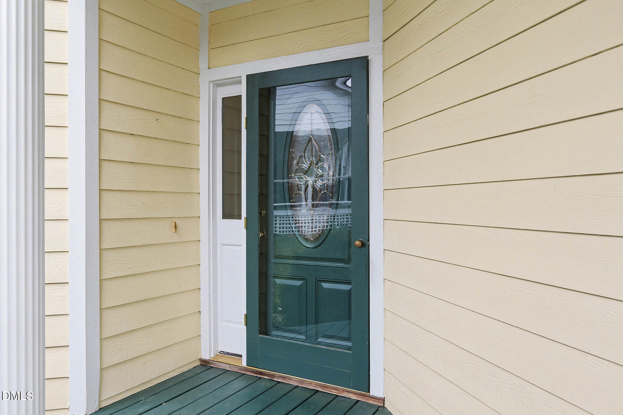 10415 Ashmead Lane Raleigh, NC 27614 - Photo 4 of 44 a view of a wooden door and wooden floor