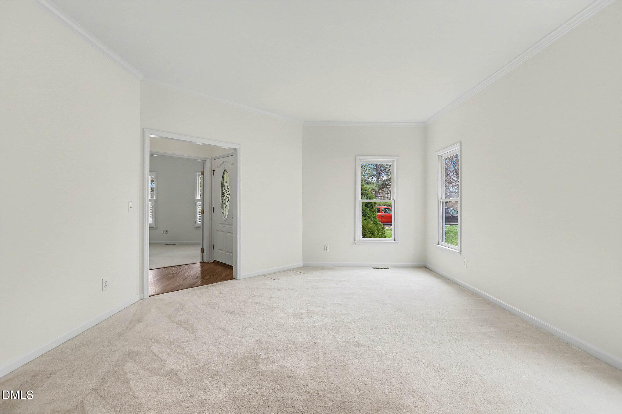 10415 Ashmead Lane Raleigh, NC 27614 - Photo 7 of 44 an empty room with windows and natural light