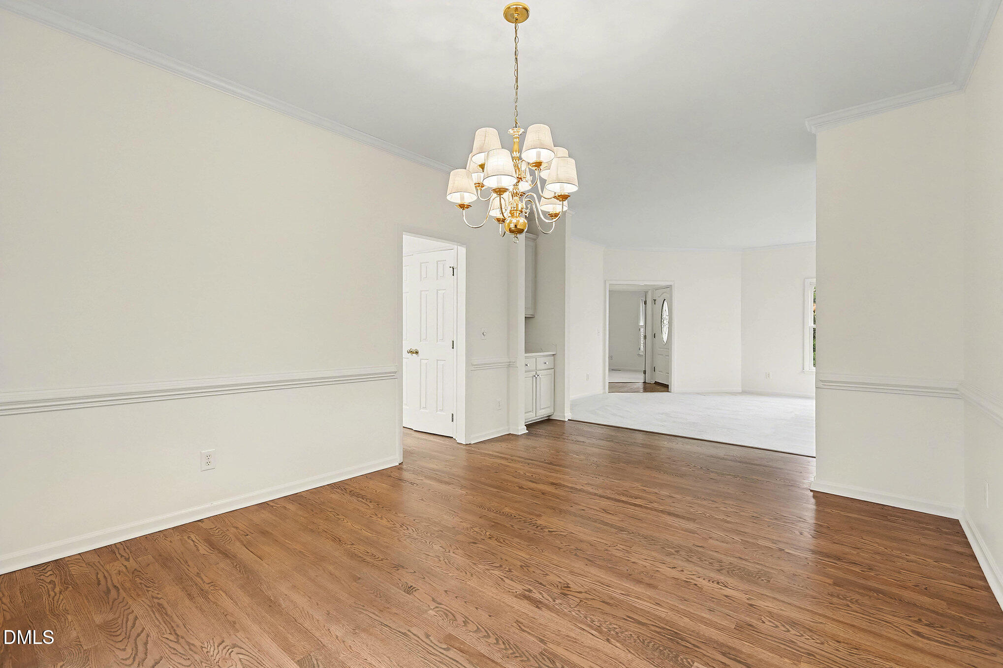 10415 Ashmead Lane Raleigh, NC 27614 - Photo 9 of 44 a view of an empty room with wooden floor and a window