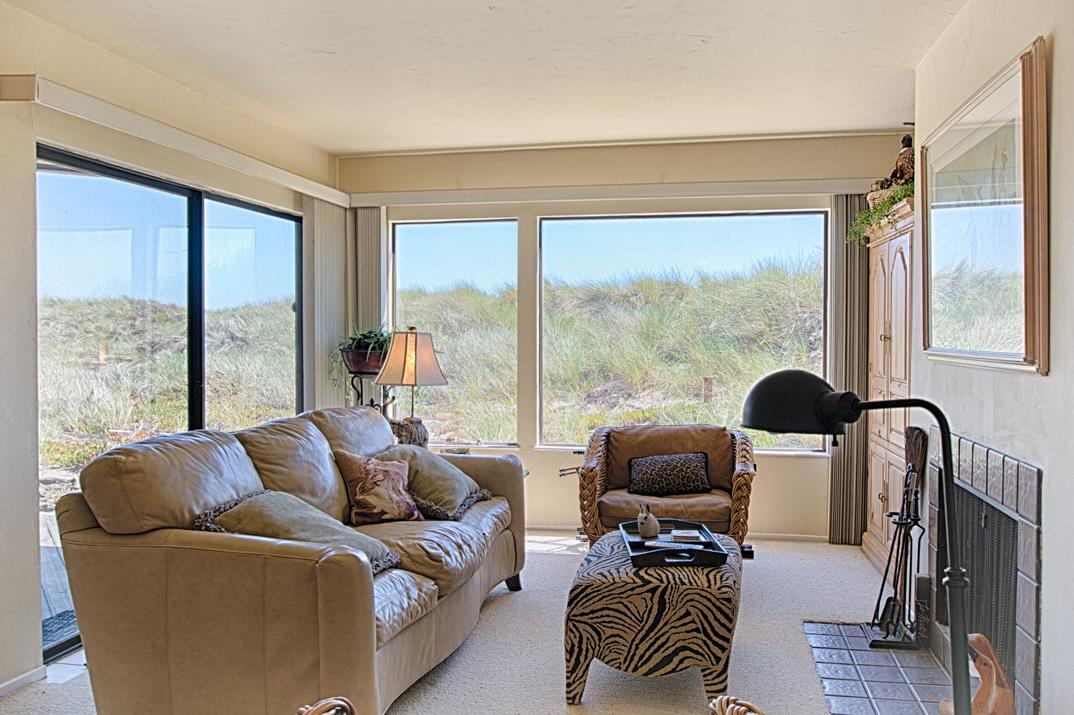 101 Shell Road, Unit 210 Watsonville, CA 95076 - Photo 7 of 26 a living room with furniture and a large window
