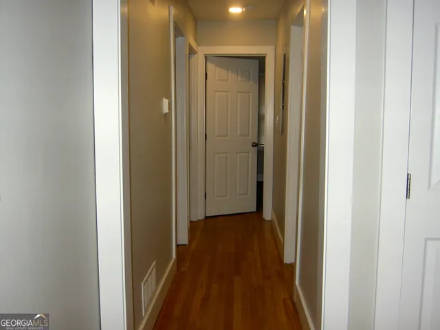 a bath tub sitting next to a white sink