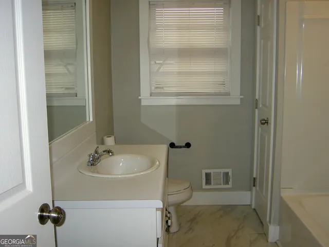 a bathroom with a shower and a bathtub