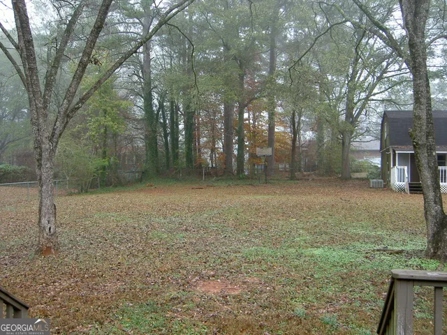 front view of a house with a tiny house and a trees