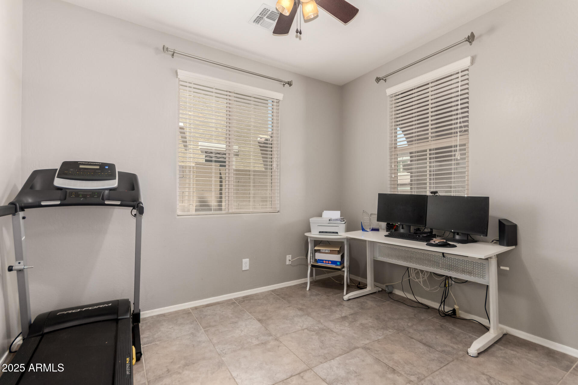 21243 West Coronado Road Buckeye, AZ 85396 - Photo 7 of 49 a view of a workspace with furniture and a window