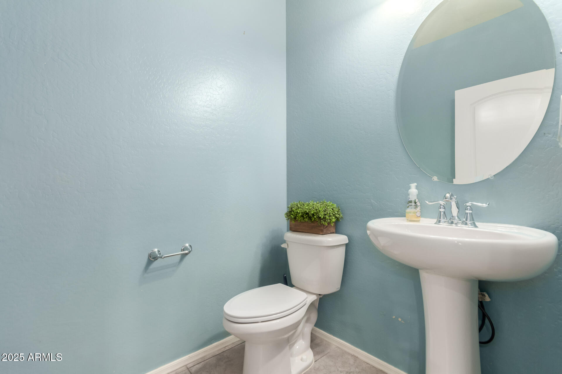 21243 West Coronado Road Buckeye, AZ 85396 - Photo 17 of 49 a bathroom with a sink toilet and a mirror