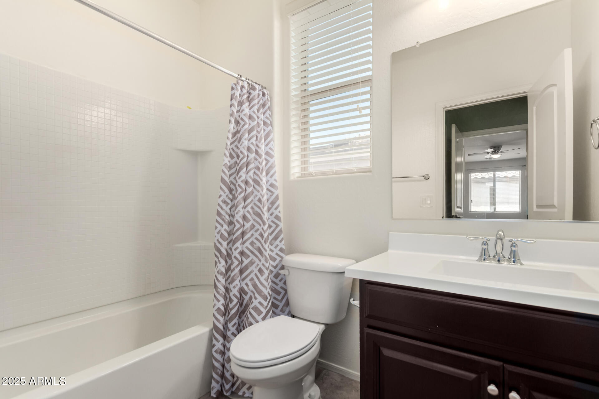 21243 West Coronado Road Buckeye, AZ 85396 - Photo 24 of 49 a bathroom with a sink toilet and shower