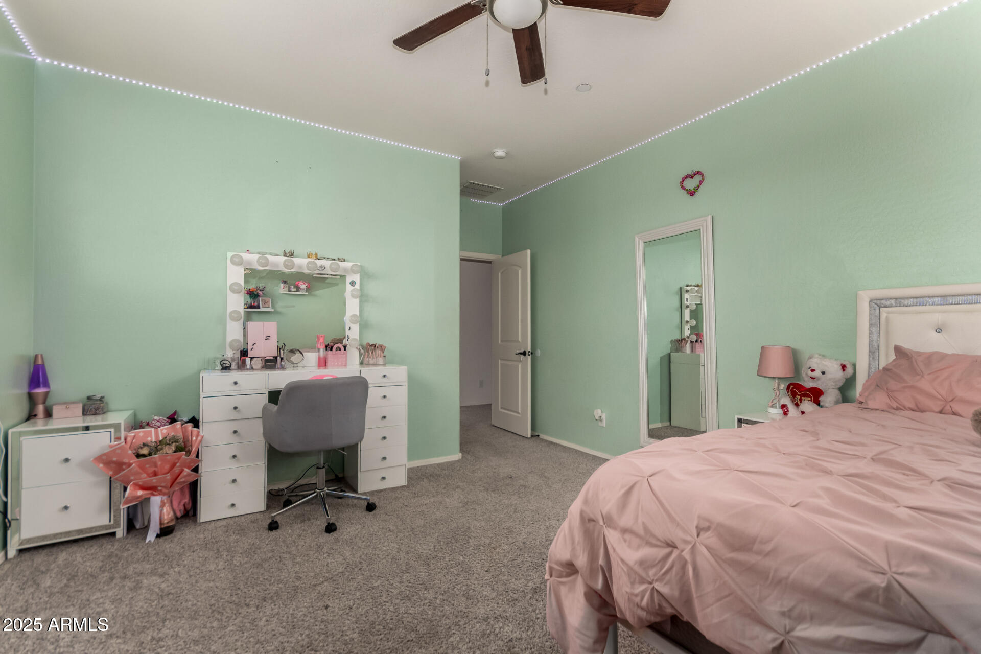 21243 West Coronado Road Buckeye, AZ 85396 - Photo 27 of 49 a bedroom with a bed and a desk