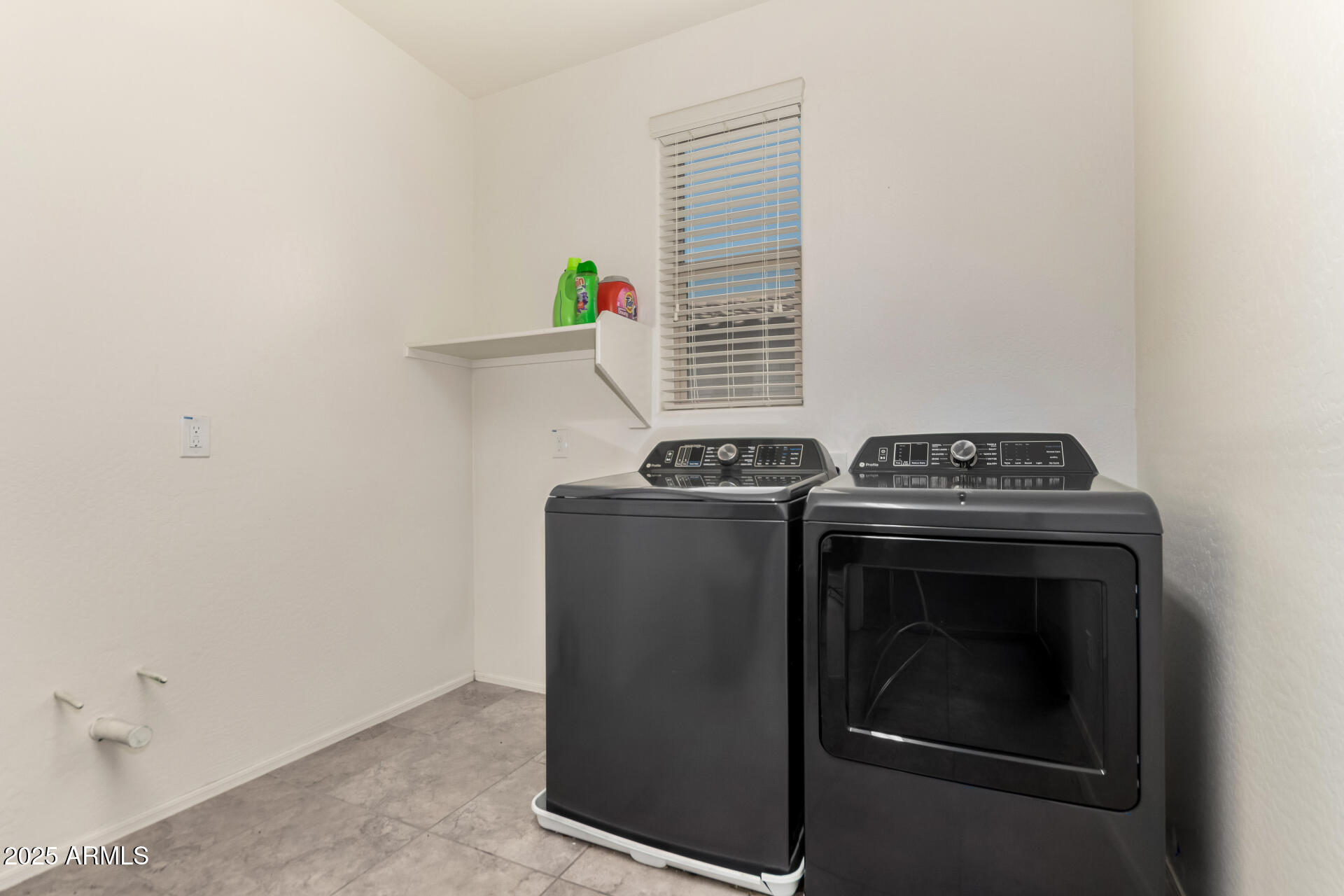 21243 West Coronado Road Buckeye, AZ 85396 - Photo 29 of 49 a view of washer and dryer in a room