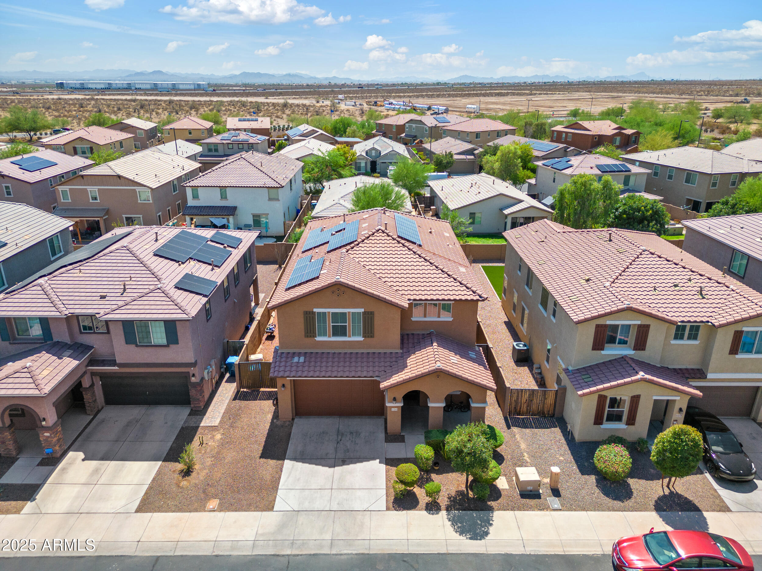 21243 West Coronado Road Buckeye, AZ 85396 - Photo 38 of 49 an aerial view of residential houses with outdoor space
