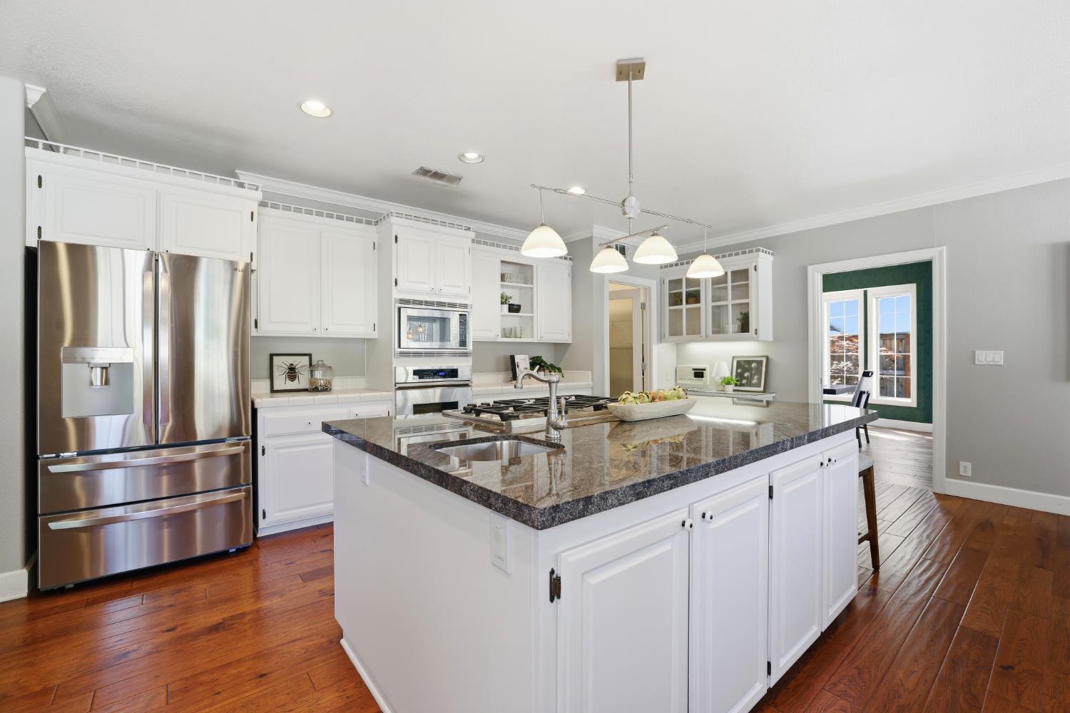 4330 Hale Ranch Lane Fair Oaks, CA 95628 - Photo 28 of 77 a kitchen with stainless steel appliances granite countertop a sink stove and refrigerator