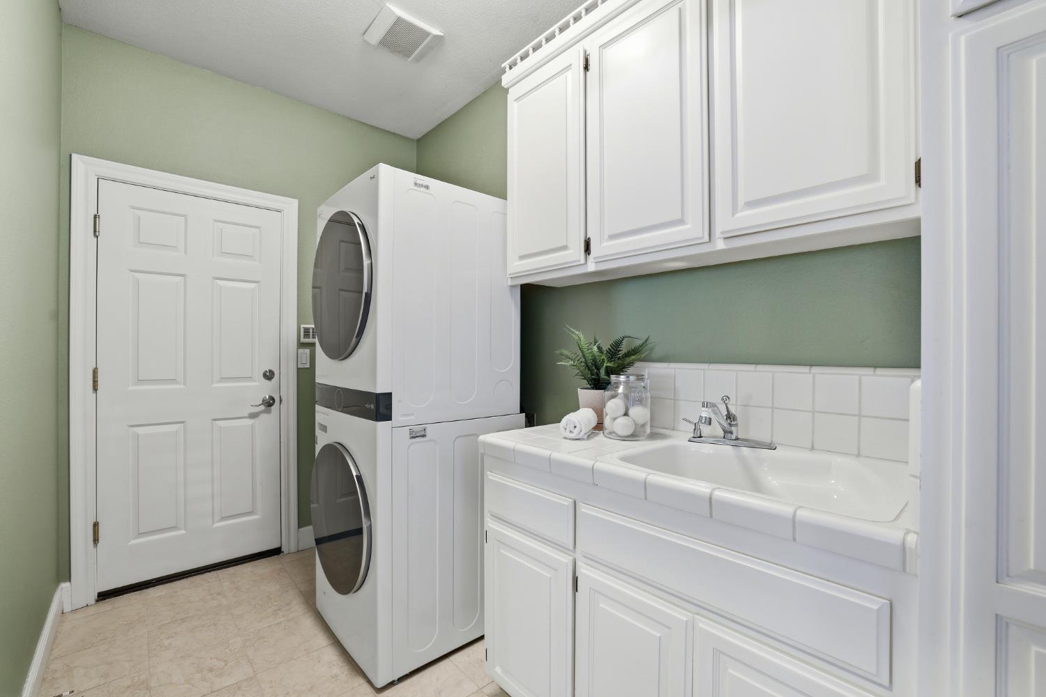 4330 Hale Ranch Lane Fair Oaks, CA 95628 - Photo 40 of 77 a bathroom with a sink and a washing machine