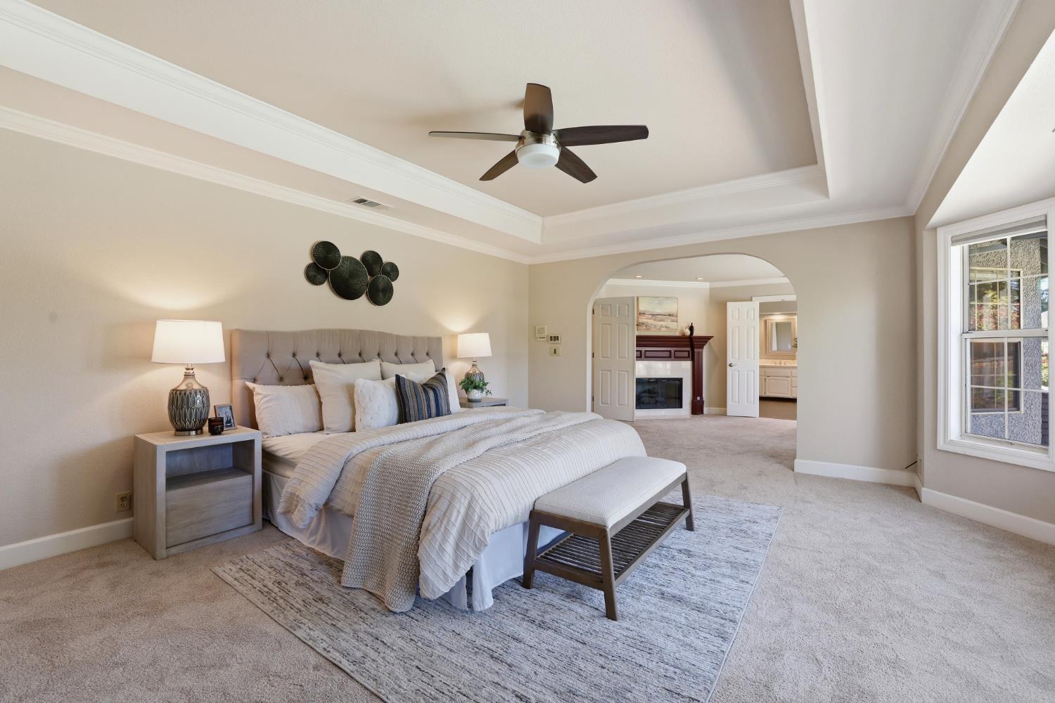 4330 Hale Ranch Lane Fair Oaks, CA 95628 - Photo 46 of 77 a spacious bedroom with a large bed and a ceiling fan