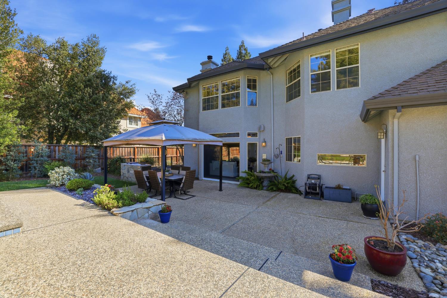 4330 Hale Ranch Lane Fair Oaks, CA 95628 - Photo 68 of 77 a view of a patio with table and chairs under an umbrella