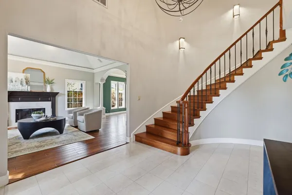 a kitchen with a sink cabinets and wooden floor