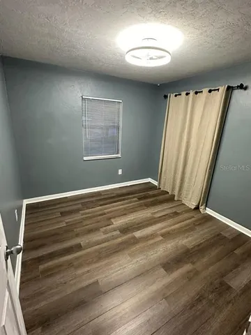 a view of room with window and stairs