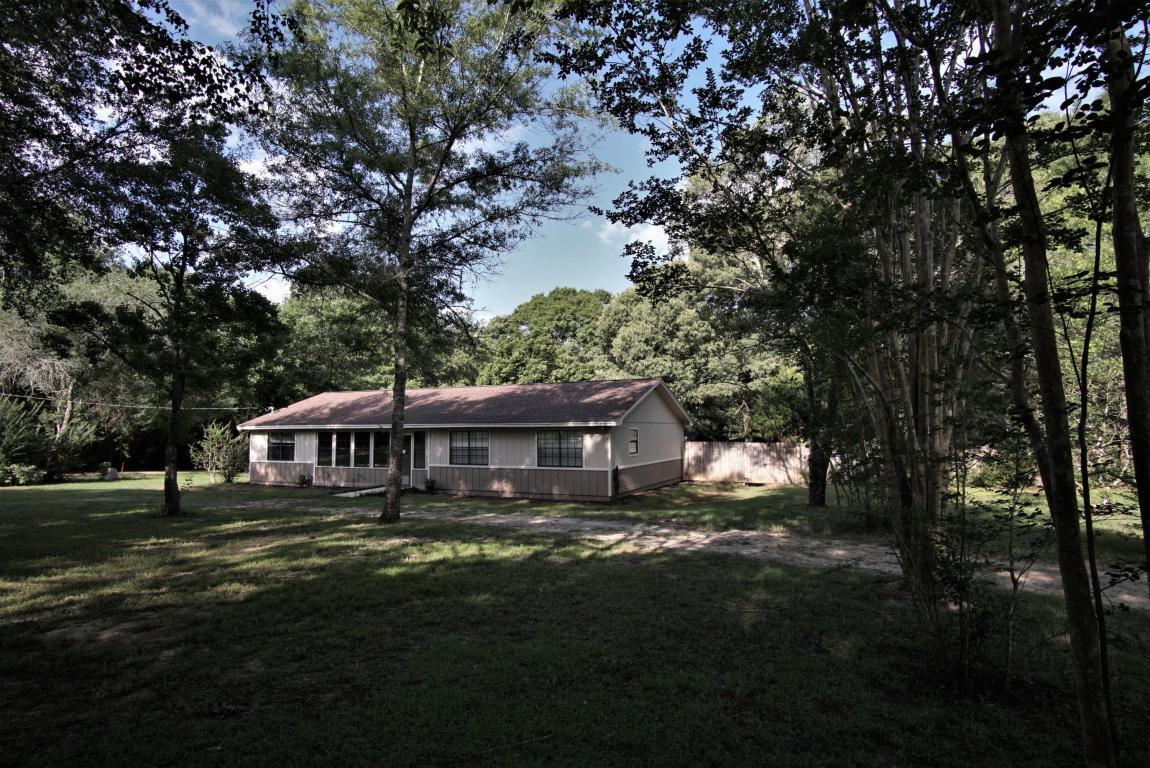 6564 Old River Road Baker, FL 32531 - Photo 1 of 70 a view of a house with backyard porch and sitting area
