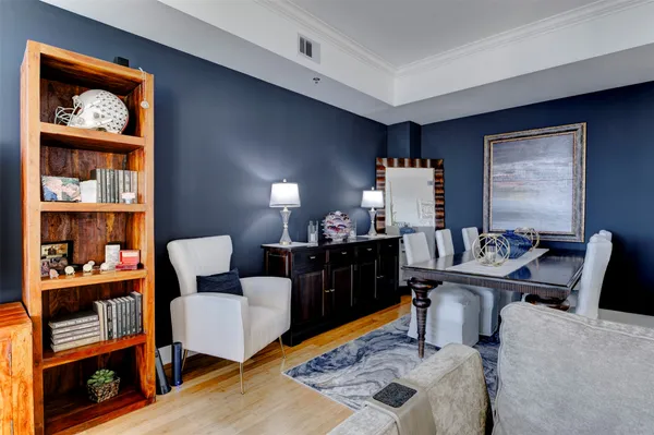a living room with furniture and a lamp