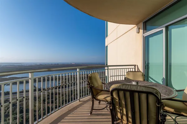 a view of balcony with wooden floor
