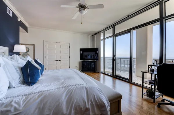 a bed room with a bed and a television
