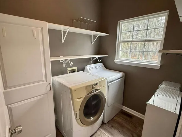 a bathroom with a sink a mirror a vanity and window