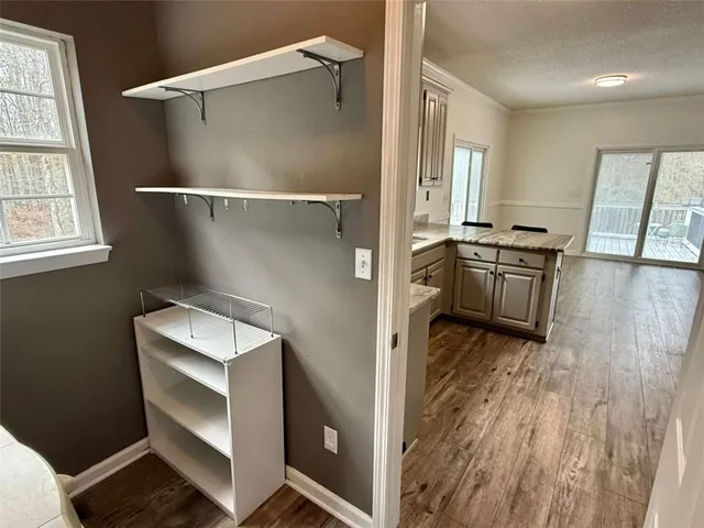 an empty room with closet and a chandelier fan