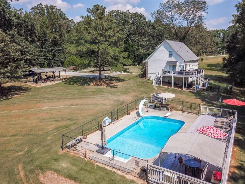 460 Rivers Road Fayetteville, GA 30214 - Photo 2 of 69 a view of a house with pool and chairs