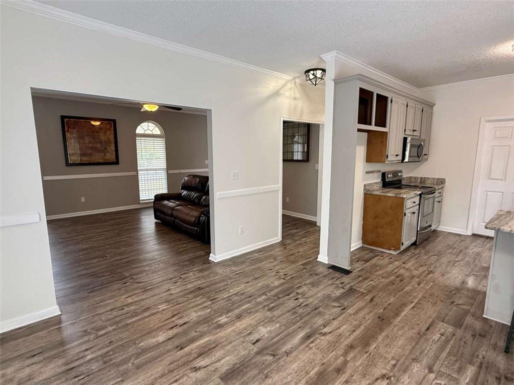460 Rivers Road Fayetteville, GA 30214 - Photo 21 of 69 a view of a kitchen with a sink stove cabinets and empty room