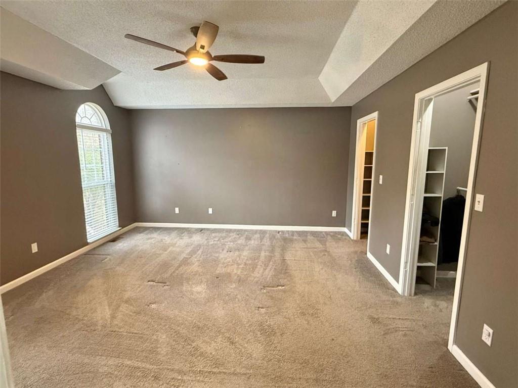 460 Rivers Road Fayetteville, GA 30214 - Photo 26 of 69 an empty room with closet and a chandelier fan