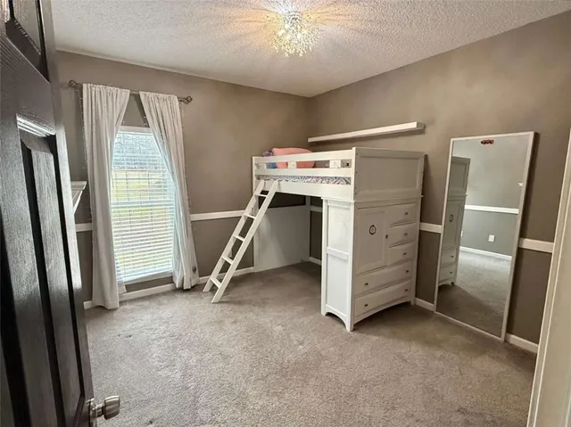 a bathroom with a sink mirror vanity and toilet