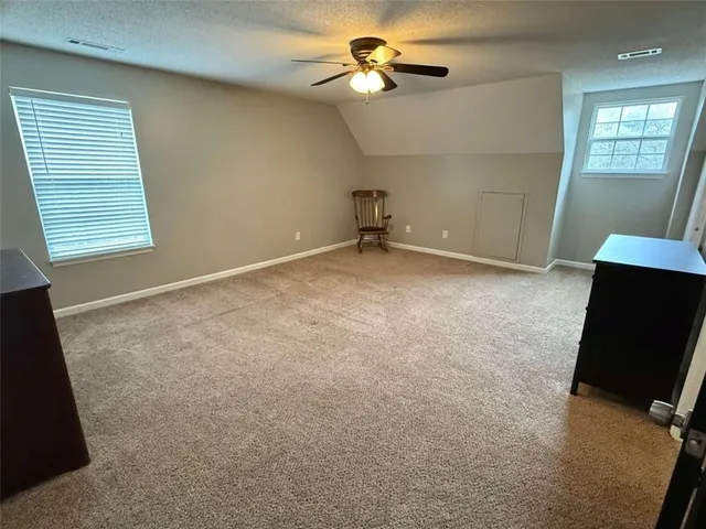 a bathroom with a toilet sink and shower