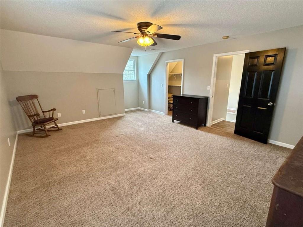 460 Rivers Road Fayetteville, GA 30214 - Photo 41 of 69 a view of a livingroom with a ceiling fan and a rug