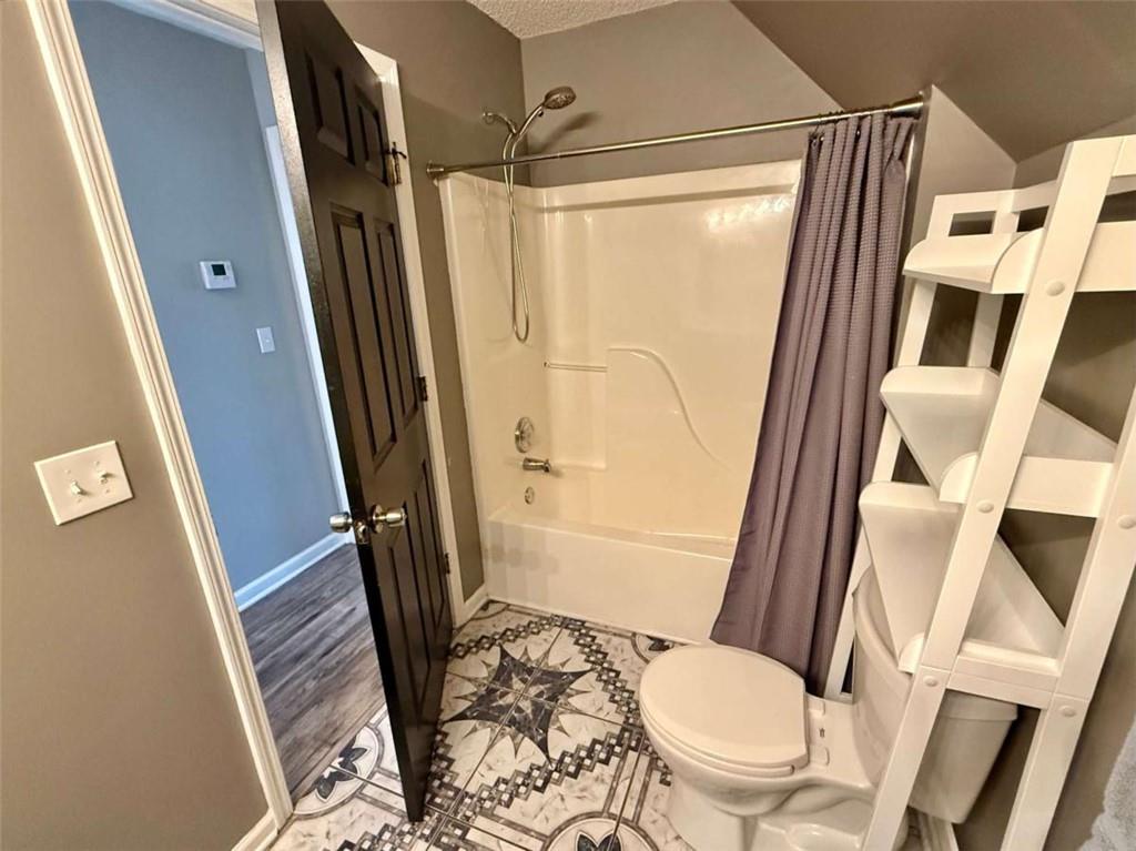 460 Rivers Road Fayetteville, GA 30214 - Photo 45 of 69 a bathroom with a toilet and a shower