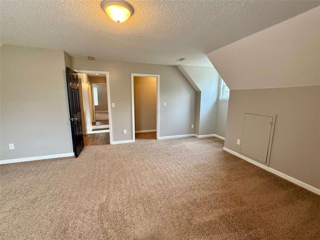 460 Rivers Road Fayetteville, GA 30214 - Photo 48 of 69 a view of an empty room with wooden floor and windows