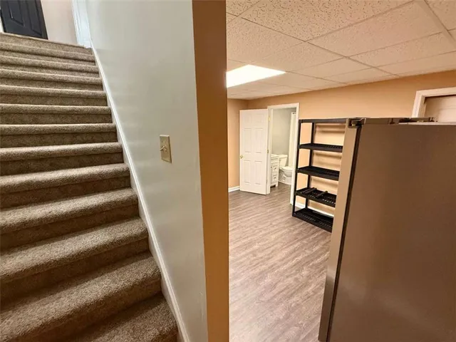 a view of a house with backyard porch and sitting area