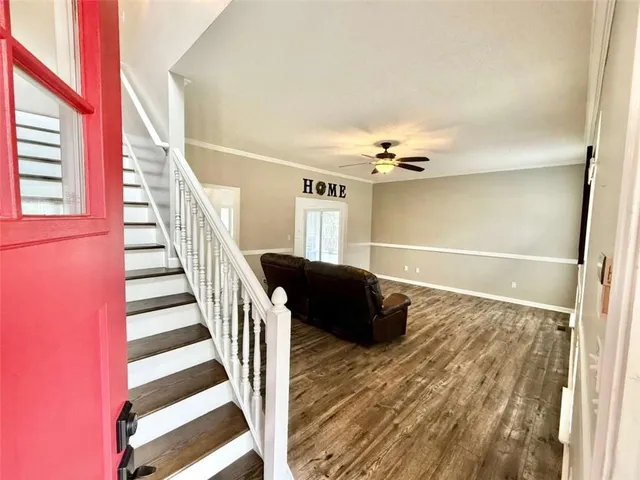 a view of livingroom with hardwood floor and ceiling fan
