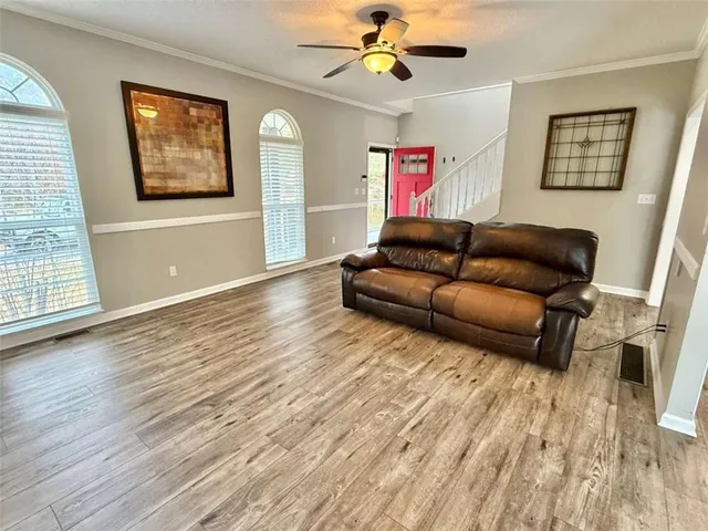 a view of kitchen with refrigerator microwave and wooden floor
