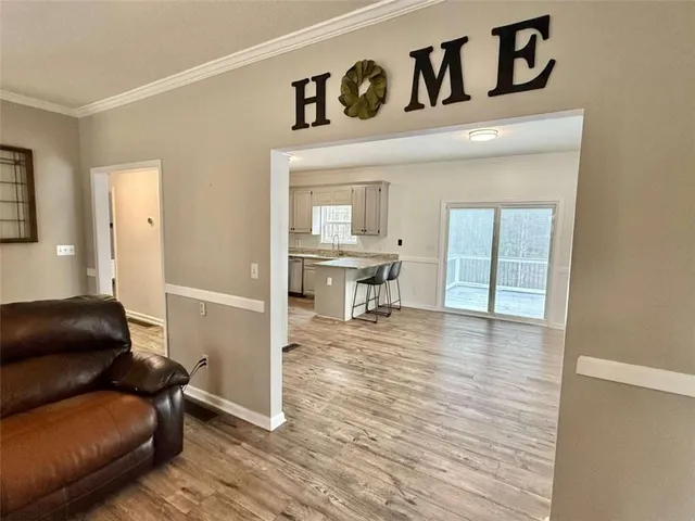 a kitchen with granite countertop a refrigerator stove and microwave