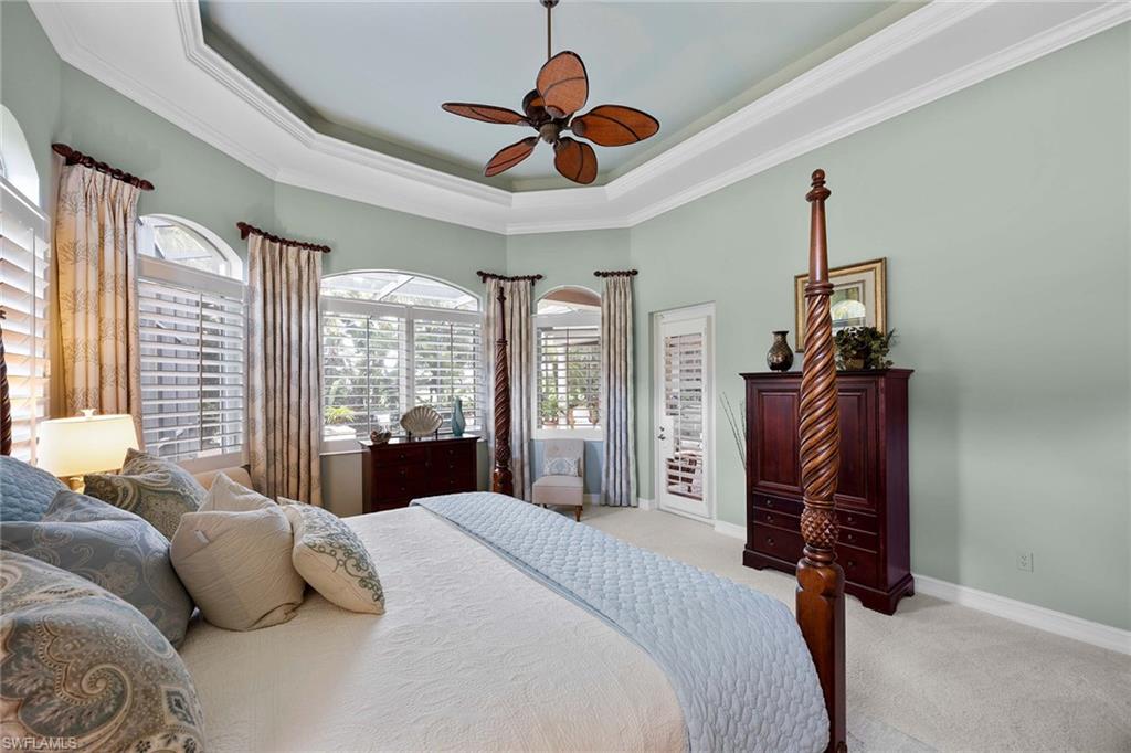 9038 Shenendoah Circle Naples, FL 34113 - Photo 15 of 50 a bedroom with a bed dresser and a window