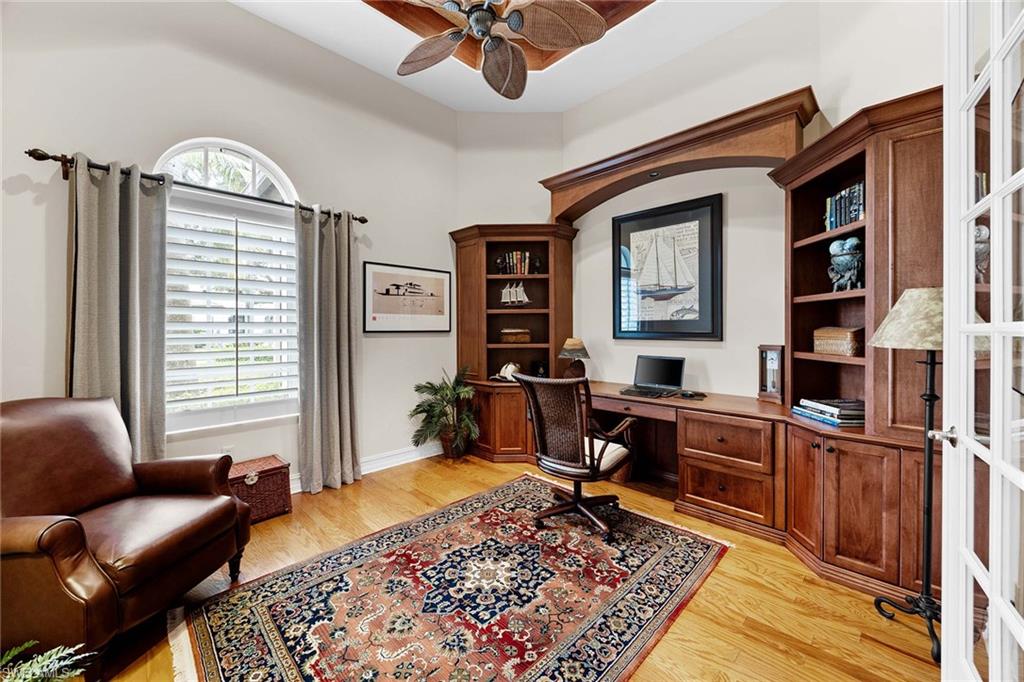 9038 Shenendoah Circle Naples, FL 34113 - Photo 18 of 50 a bedroom with furniture and a rug