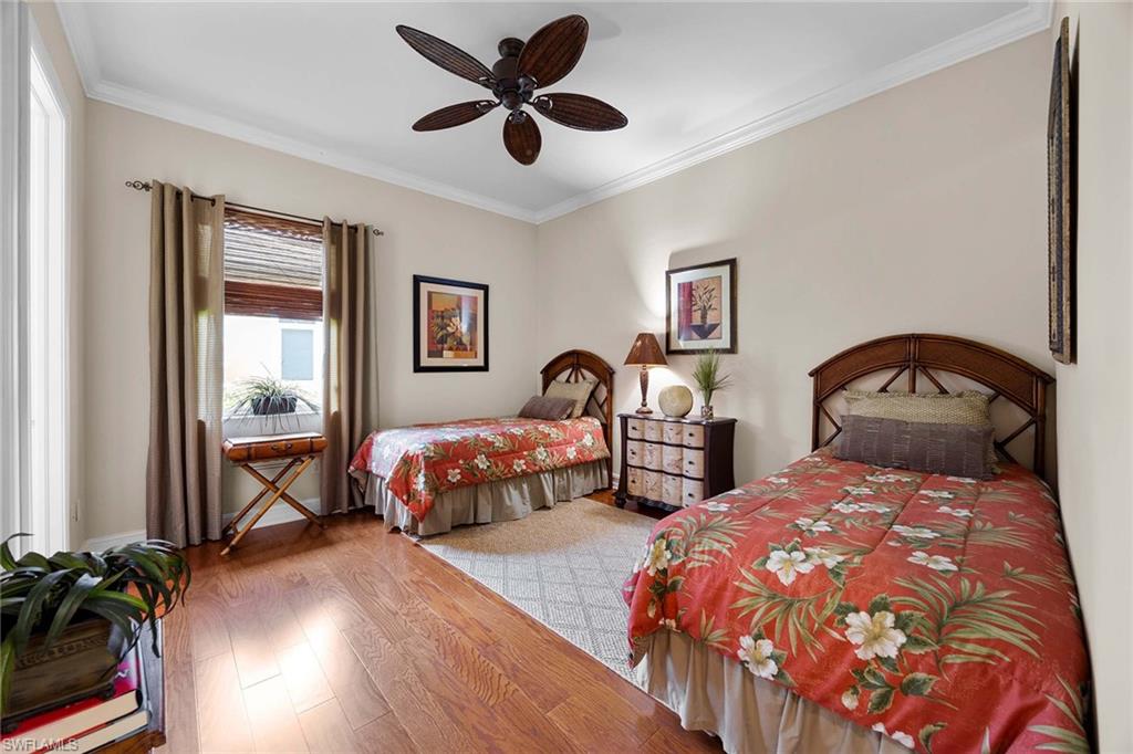9038 Shenendoah Circle Naples, FL 34113 - Photo 22 of 50 a spacious bedroom with two beds and a window