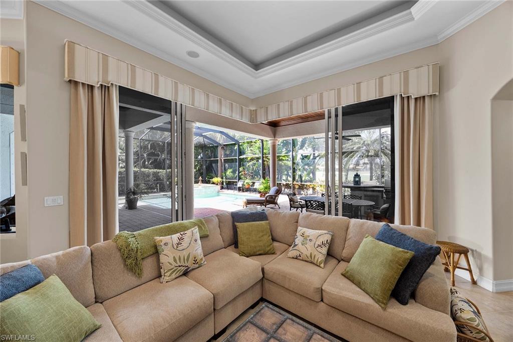 9038 Shenendoah Circle Naples, FL 34113 - Photo 27 of 50 a living room with furniture and a large window